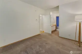 Primary bedroom with entrance to vanity