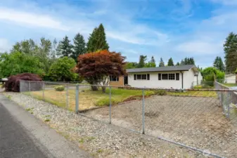 Fully fenced front yard.