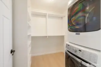 Laundry in large walk-in closet off primary