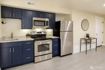 Additional kitchen in basement allows for additional entertaining space, visitors, or pantry space.