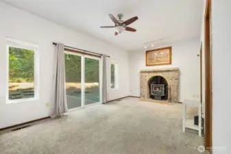 Just a few stairs down to the living room, with a 1/2 bathroom and laundry room