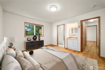 This is one of the main floor bedrooms that share a closet and bathroom.