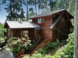 The western side of your home. The 15 acre sculpture forest park (Price Sculpture Park) borders your land.