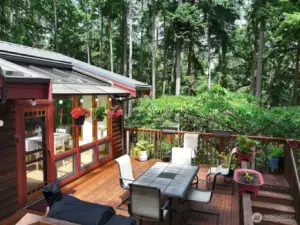 Mature landscaping surrounds you and creates a lovely buffer of privacy. Stairs to the right side of this photo lead to your spacious yard and to the lower level entrance of your home.