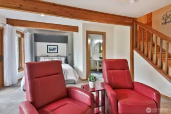 This room currently lives as a family room with a Murphy Bed and it's own 3/4 bath. There is a wonderful storage closet down here and your access to your garage is on this level.