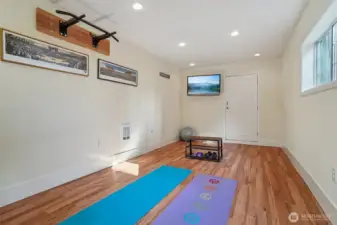 Seller used this space as their workout room. Would also make a great office or could converted back to a one car garage. Door at rear wall leads to alley way