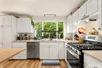 The updated kitchen with island is the perfect place to connect and share meals.
