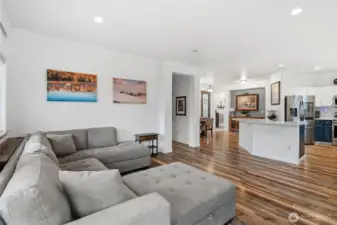 Bright and inviting living space filled with natural light, perfect for relaxing or entertaining.