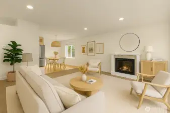 Spacious living area with electric fireplace. (virtually staged)