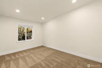 Spacious Primary Bedroom with vaulted ceilings. New carpet