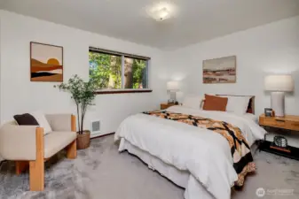 The biggest of the three bedrooms, this room features wall to wall carpet (with hardwoods underneath) and room to spare.