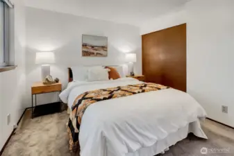 Another look at the first bedroom highlights the ample closet space.
