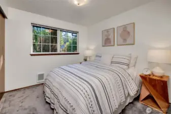 The second of the three bedrooms also features hardwoods under the carpet and plenty of closet space.