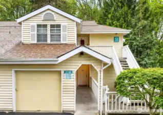 Charming entry level, covered, end unit! With attached garage.