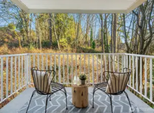 French doors opening up to private balcony overlooking peaceful greenbelt