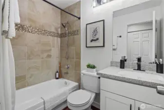 Nicely updated guest bathroom featuring a full bath.