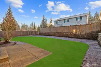 Fully fenced leveled backyard with patio