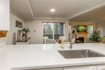 Fully-remodeled in 2023, the kitchen overlooks the dining and living areas