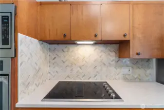 new tile backsplash and quartz countertops