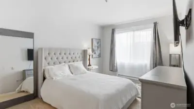 A beautifully appointed primary bedroom with generous space to unwind.