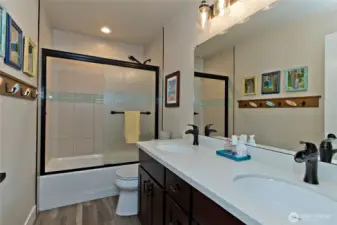 Upstairs full bathroom with updated tile & new vanity.