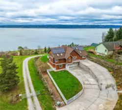 Camano Island Waterfront perfection on 2.7 acres— One of a kind home with private deeded tidelands, walk or drive to direct gated beach access!