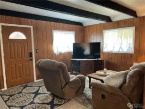 Cozy Living Room with beamed ceiling to add to the cottage feel.