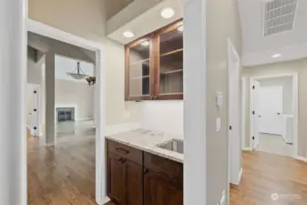 Combination wetbar & butler's pantry with new cabinets and counters.