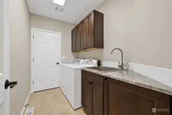 Utility room with new cabinets & counter.