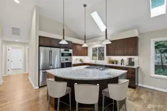 Updated kitchen with new cabinets, granite counters, lighting & sink