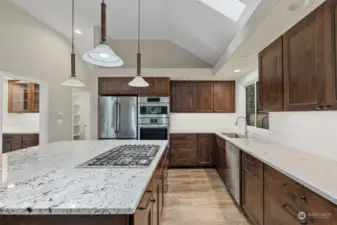 Handsome granite counters. Huntwood cabinets.