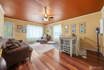 Flowing floor plan & beautiful hardwood floors in the living room, & a large picture window overlooking the front yard providing an abundance of natural light.
