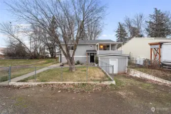 Front exterior with exterior shed