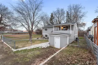 Front exterior with exterior shed