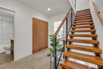 Beautiful stairs to the 3rd floor primary suite.