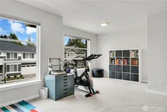 Bedroom four could be used as a bonus room because of its size and location.  This spacious room has a walk-in closet.  A small window overlooks the side yard and two oversized picture windows overlook the front yard.