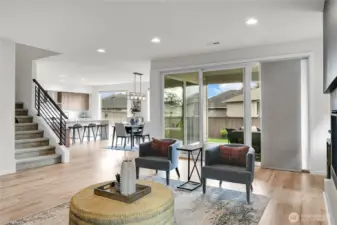 A sliding glass door leads out to the oversized deck, which is an incredible outdoor room, designed to be the perfect place to relax or entertain.  The sliding glass door in this home was designed to reach the ceiling, offering a modern, seamless look, as well as maximizing natural light and views.