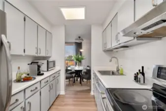 Kitchen has been updated with newer appliances, fresh painted cabinets and hardware.