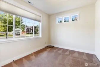 Bright and roomy, this spacious second bedroom offers versatile space for guests, an office, or personal retreat.