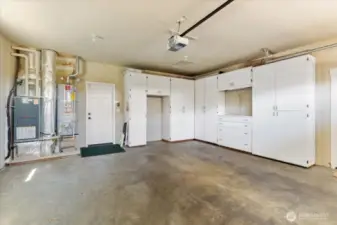 Keep your vehicles and belongings organized with ample space and custom built-in cabinets for added convenience