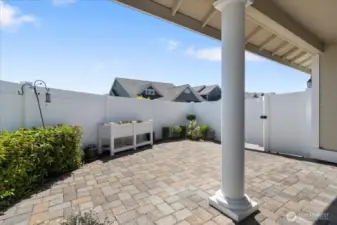 Experience privacy and charm in this fully landscaped, fenced patio area—ideal for outdoor living and entertaining.
