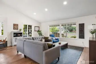 Large open living space with lots of light and new floors