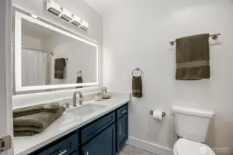 Full bath with tile flooring
