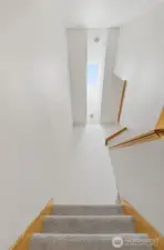 stairway with vaulted ceiling and skylight