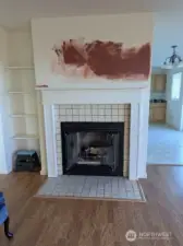 Wood burning fireplace in living room on upper floor