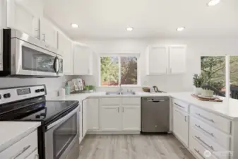 Prep meals in your updated eat-in kitchen complete with quartz countertops and stainless steel appliances.