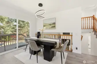 Dining room with access to the backyard. Lower stairs lead to the family room.