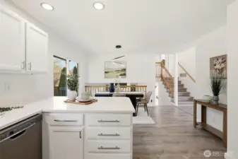 The upper stairs lead to the bedrooms and lower stairs take you to the family room.