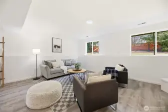 Lower flex space offers  many possibilities. Ideal for home office, guest area, workout room, media space, or playroom.