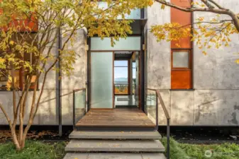 Roof rainwater collected into a steel moat entry water feature